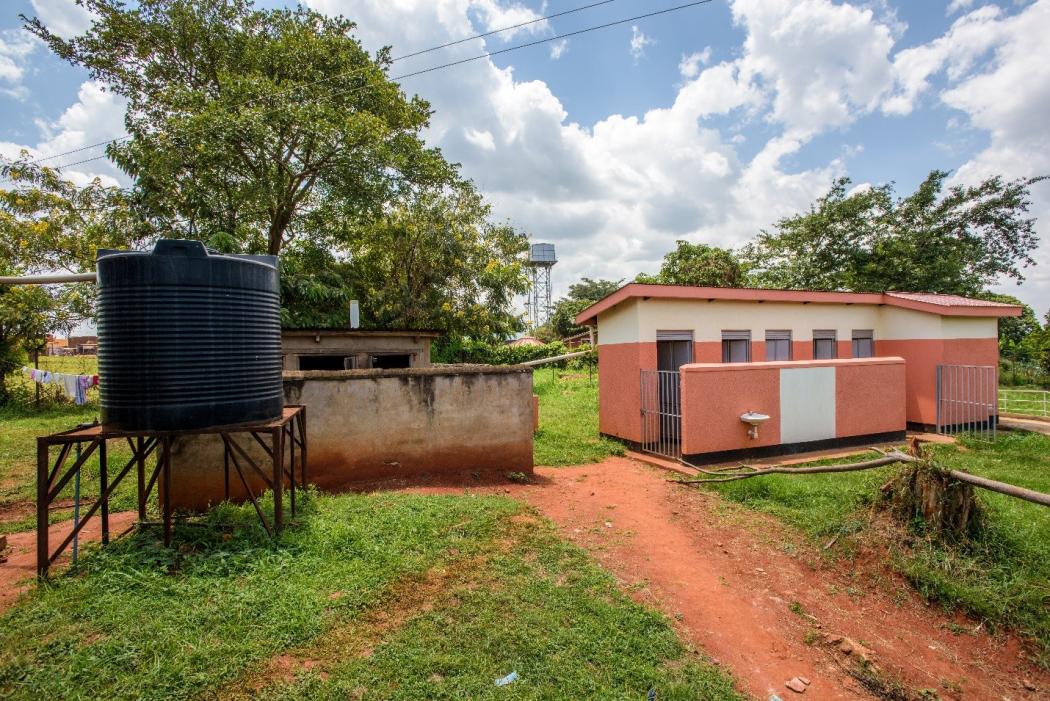 Health clinic latrines and water put in by World Vision at Ntwetwe Health Center IV, next to the old system on the left.
Photo Credit – Jon Warren, World Vision, 2016