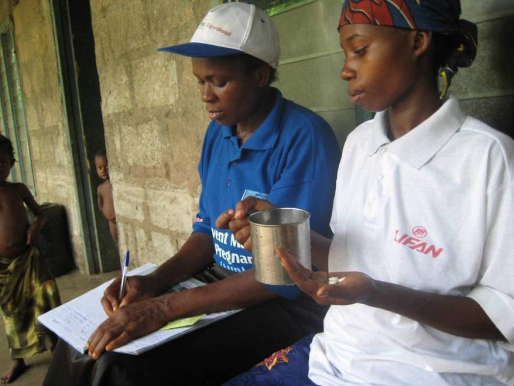 Uduak Imo Bob (left) is a volunteer community health worker, helping to prevent malaria among women and children in her home state of Akwa Ibom in Nigeria. She is working with a Malaria in Pregnancy program that was introduced by Jhpiego and funded by ExxonMobil. Credit: Jhpiego