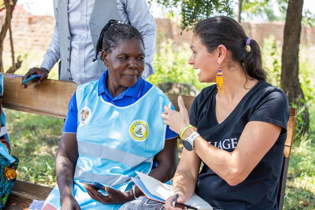 Community Health Worker (CHW) Martha Masawa speaking with Carla Blauvelt, Senior Director of Global Programs, VillageReach. Photo credit: Joseph Ngaruiya