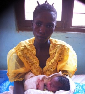 Ashura Baraka, 25, with her new baby girl, Upendo. Photo credit: Jhpiego