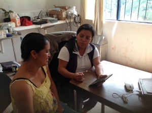 A CES health worker field tests the app with a patient. Courtesy Hesparian Health Guides.